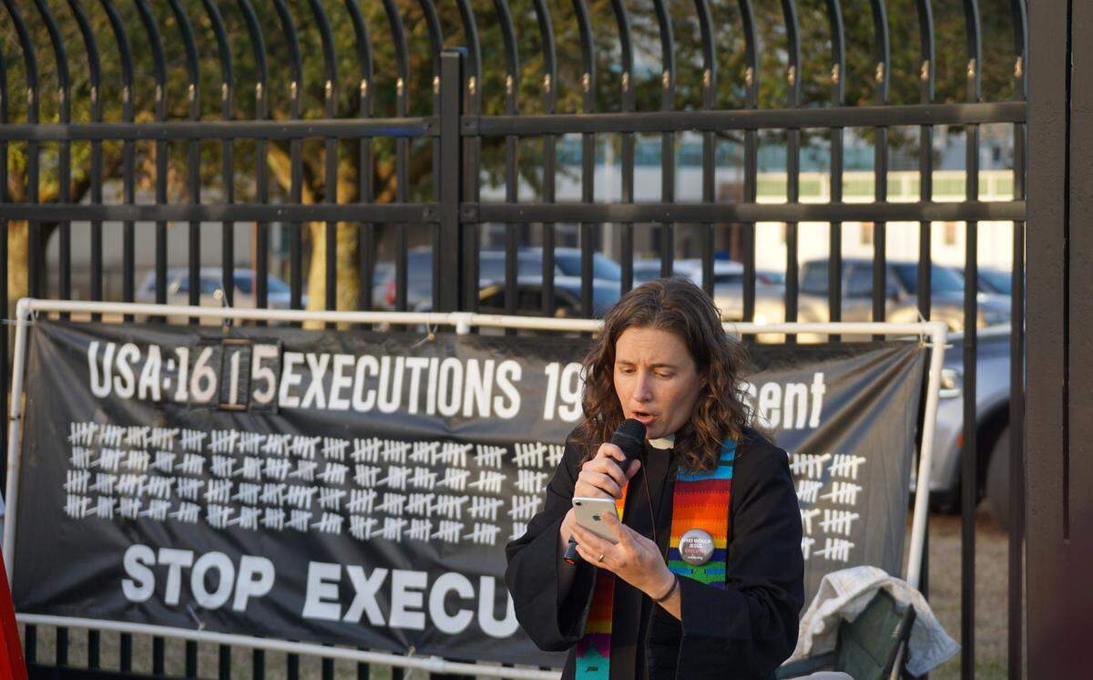 Rev. Hillary Taylor leads recites the names of all of the people who have been executed in South Carolina since 1980 at a vigil for Brad Sigmon.