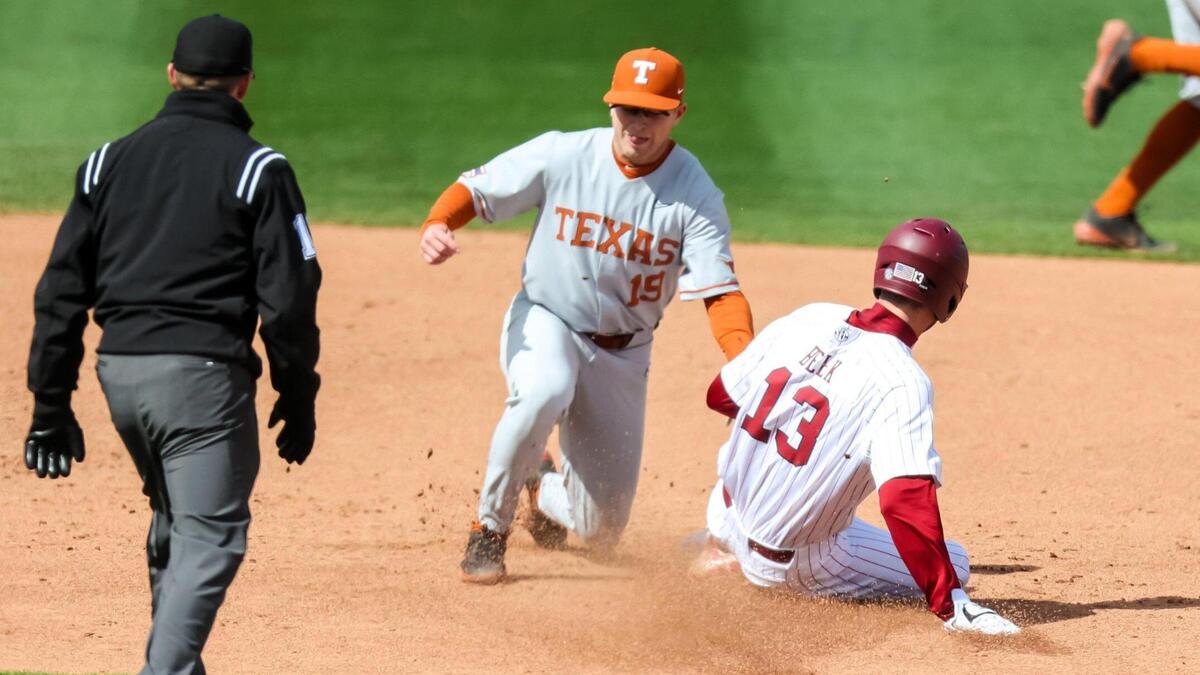 South Carolina Gamecocks infielder Brandt Belk (13) is caught stealing by Texas Longhorns infielder Mitchell Daly (19) during their game at Founders Park Saturday, March 12, 2022.