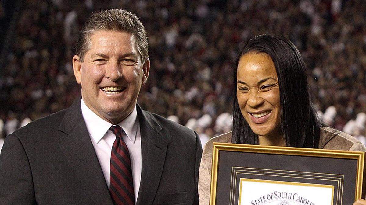 From 2013: Joined by athletic director Ray Tanner, USC’s women’s basketball coach Dawn Staley is awarded the Order of The Palmetto by then Gov. Nikki Haley.