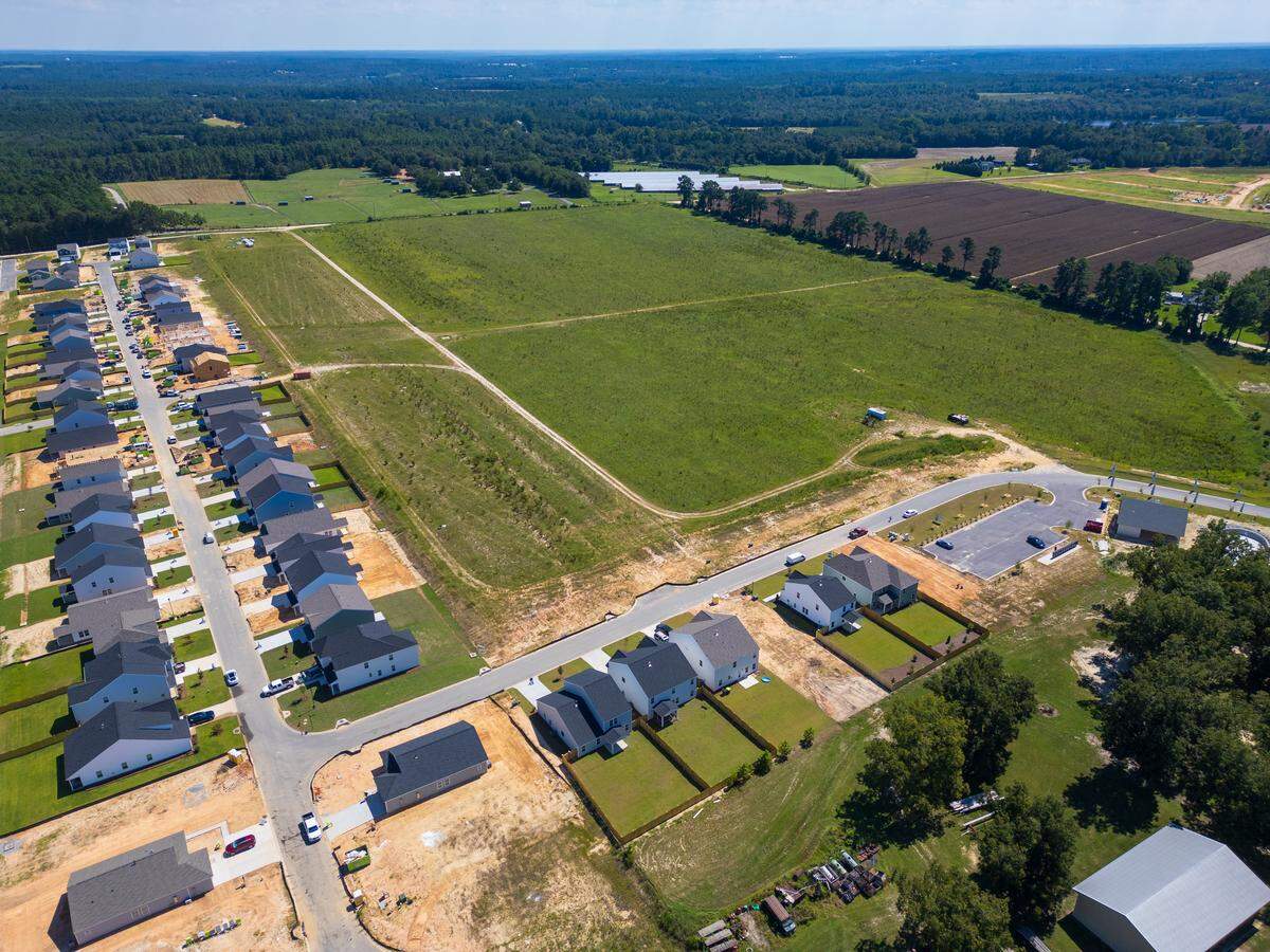 New housing, a businesses and even more housing under construction in Gilbert, South Carolina on Friday, August 29, 2025.