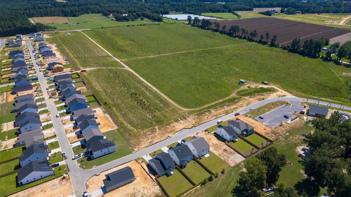New housing, a business and even more housing under construction in Gilbert, South Carolina on Friday, August 29, 2025.