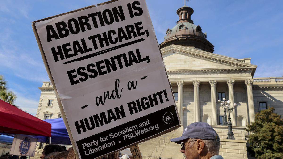 While a senate subcommittee debated a total abortion ban, people rallied outside at the South Carolina State House on Tuesday, Nov. 18, 2025.