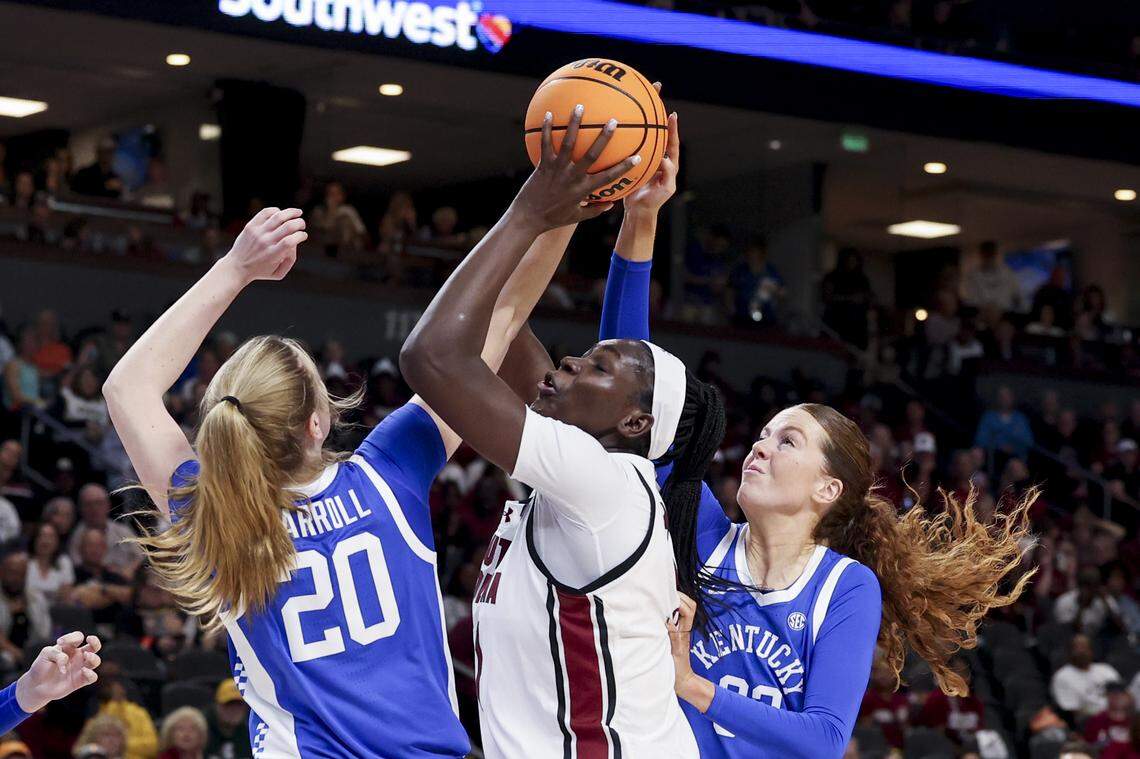 South Carolina's Madina Okot (11) shoots as Kentucky’s Kaelyn Carroll (20) and Kentucky’s Amelia Hassett (32) during the first half of action of their women's basketball game in the SEC Tournament, against Kentucky at the Bon Secours Wellness Arena on Friday, March 6, 2026.