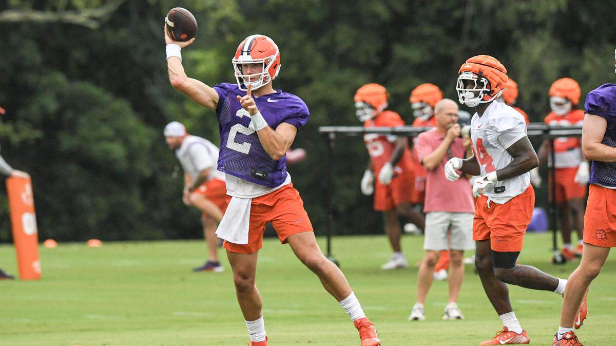 Clemson quarterback Cade Klubnik (2) passes near running back David Eziomume (24) during the Clemson first football August practice in Clemson, S.C. Thursday August 1, 2024.