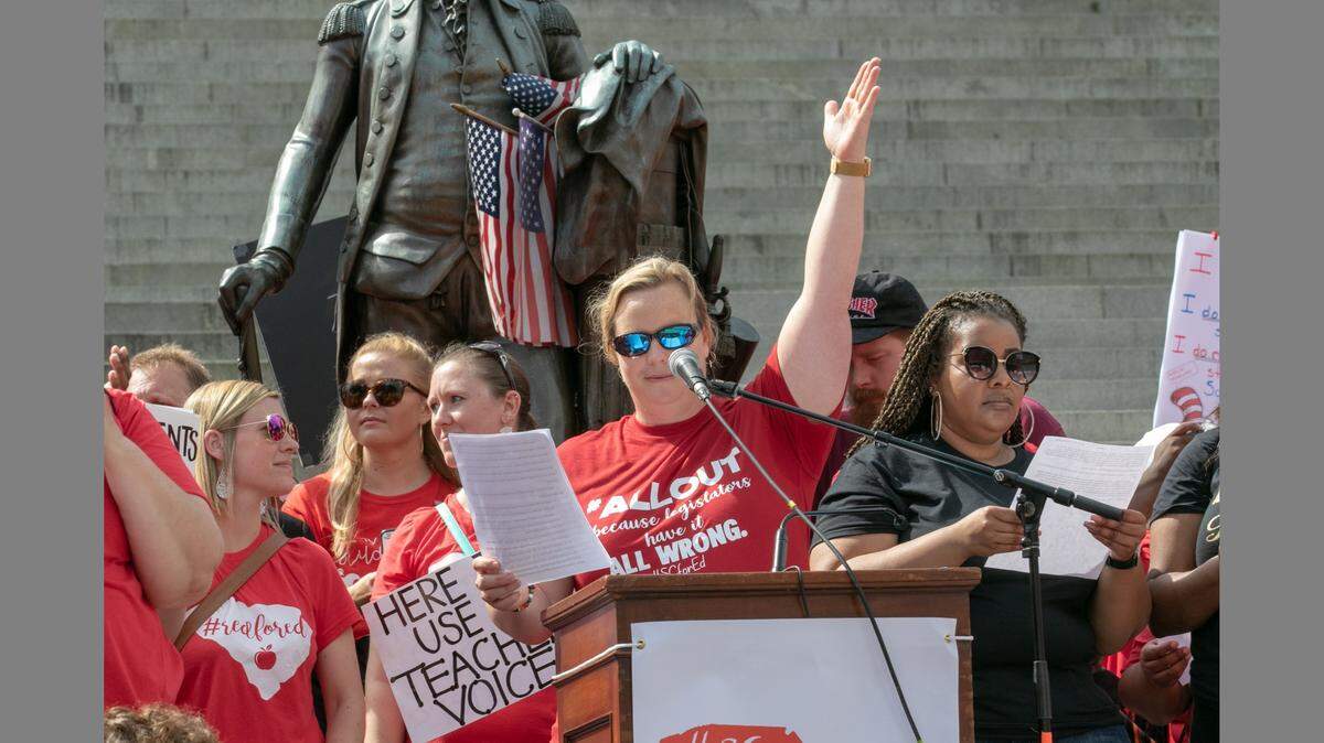 Lisa Ellis, a SC for Ed board member and teacher, talks to some 10,000 teachers, students and supporters who gathered for a rally at the South Carolina State House. (Tracy Glantz/tglantz@thestate.com)