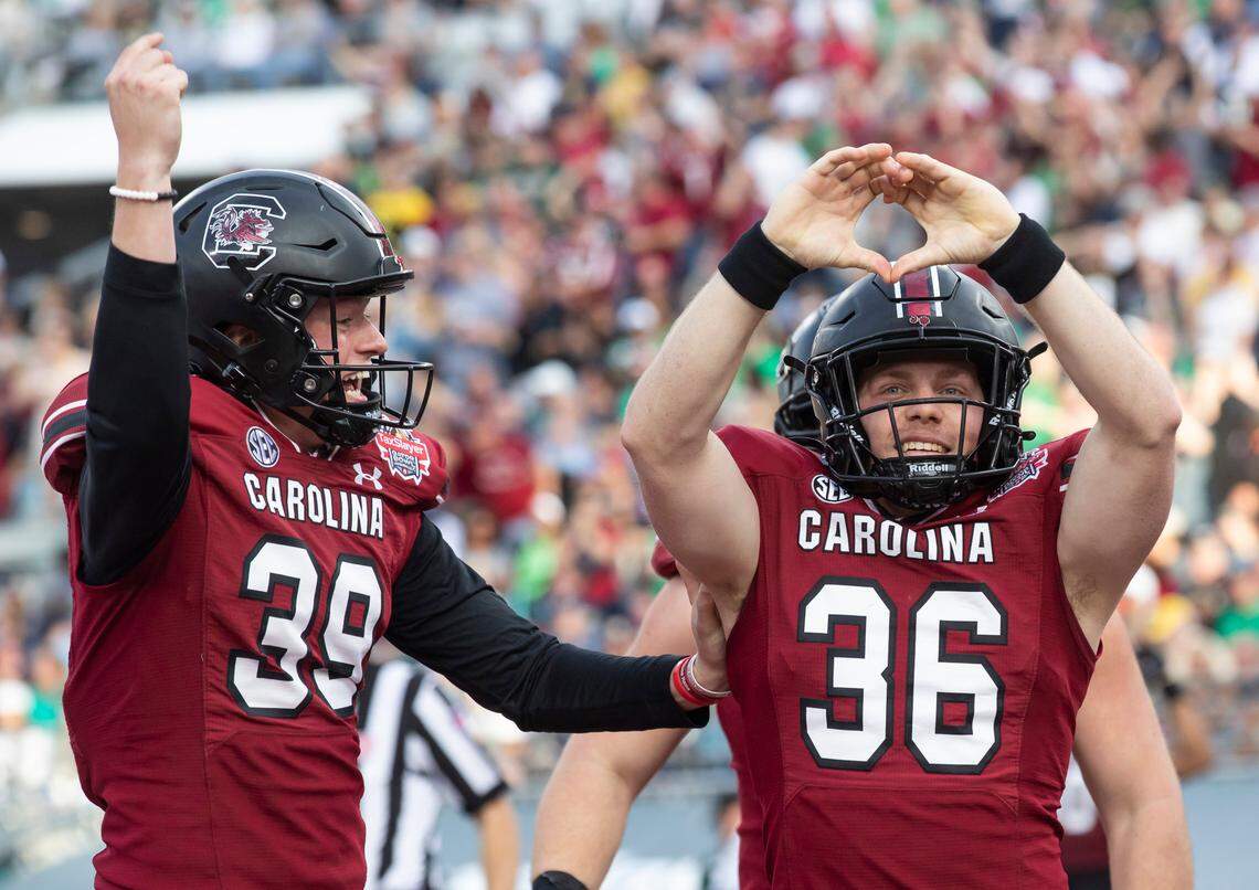 South Carolina Gamecocks long snapper Hunter Rogers (36) celebrates his touchdown from Kai Kroeger (39) against Notre Dame during the Gator Bowl at TIAA Bank Field in Jacksonville, FL on Friday, Dec. 30, 2022.