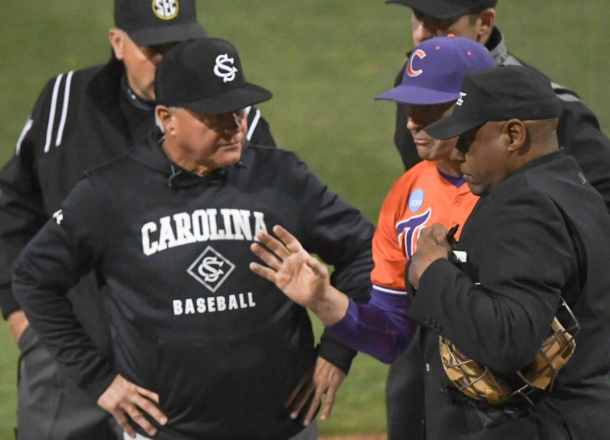 Clemson Head Coach Erik Bakich and South Carolina Head Coach Paul Mainieri talk with umpires before the game with South Carolina at Doug Kingsmore Stadium in Clemson, S.C. Wednesday, Feb 28, 2025.