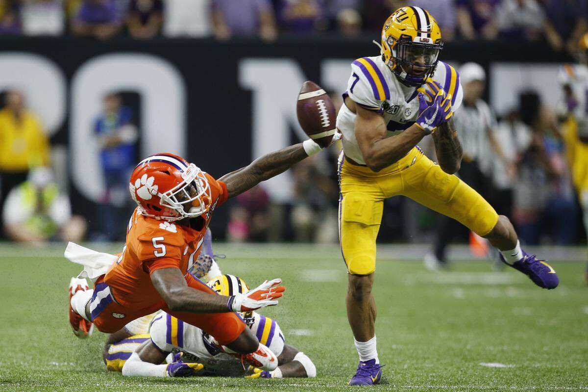 LSU safety Grant Delpit, right, breaks up a pass intended for Clemson wide receiver Tee Higgins during the first half of a NCAA College Football Playoff national championship game Monday, Jan. 13, 2020, in New Orleans. (AP Photo/Gerald Herbert)
