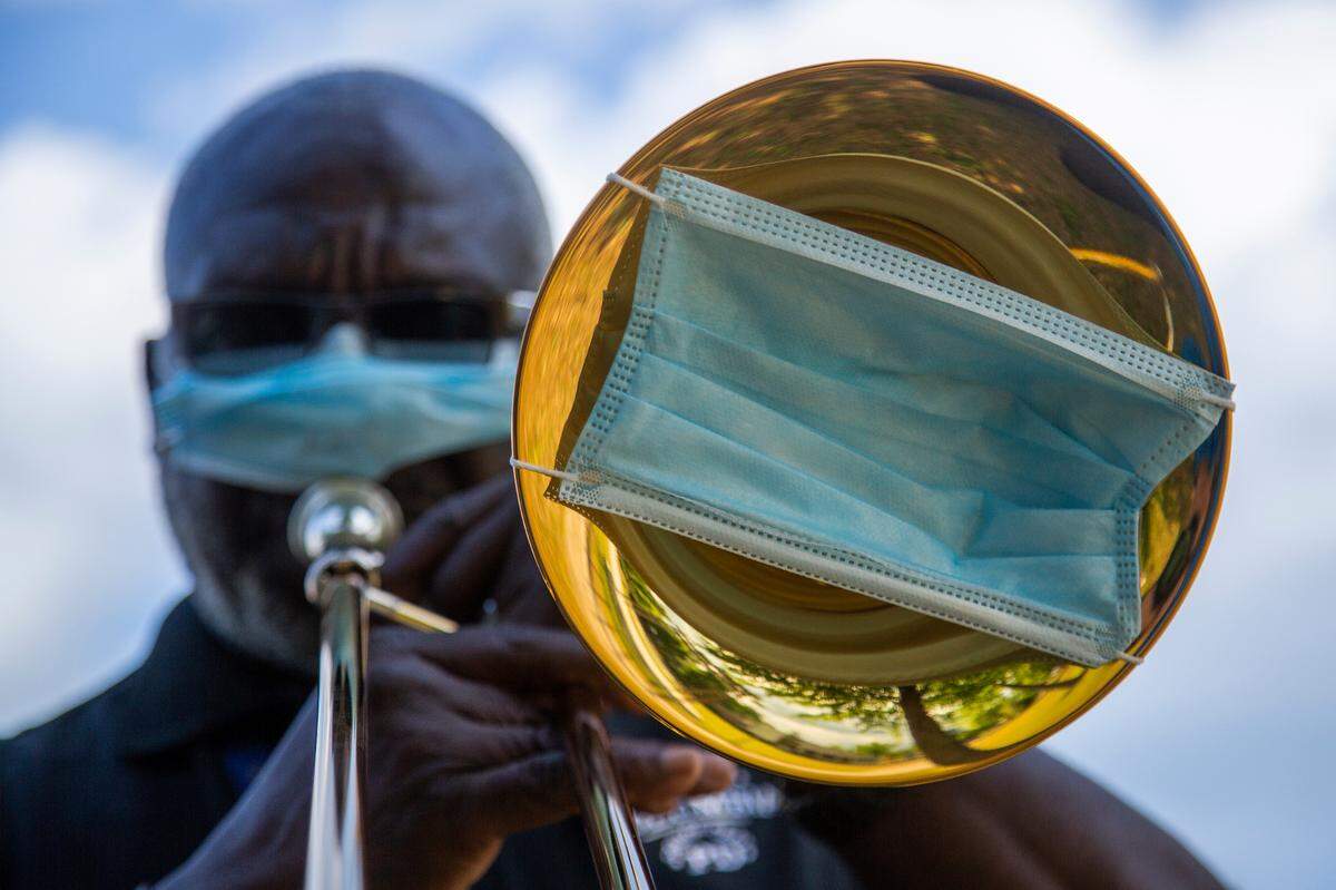 Columbia Police Department officer Clarence Sumpter practices playing “Happy Birthday” before surprising Mary Smalls’ for her ninety eighth birthday on Tuesday, April 21, 2020. First responders and neighbors drove by Smalls’ home and gave her gifts.