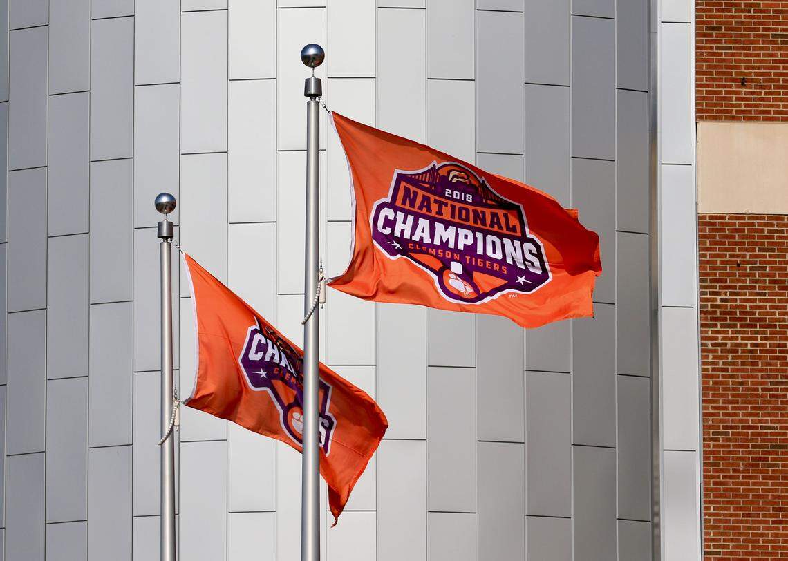 National championship flags fly Tuesday at Memorial Stadium in Clemson.