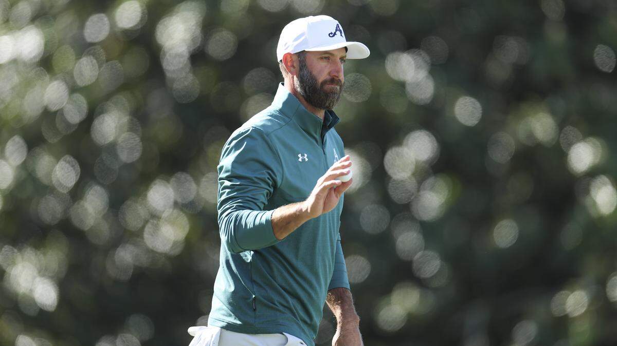 Dustin Johnson of the United States reacts on the first green during the first round of the 2026 Masters Tournament at Augusta National Golf Club.