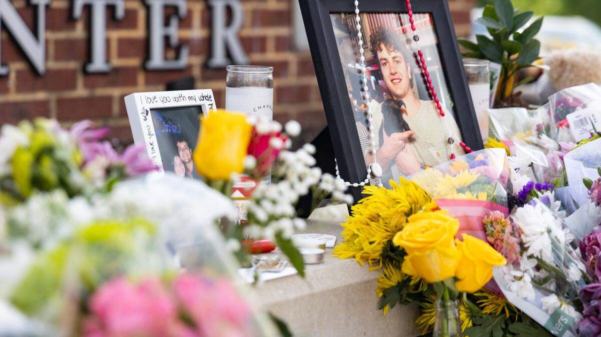 South Carolina students leave messages and flowers at a memorial for South Carolina student Nate Baker, who died after a hit-and-run crash on the intersection of Blossom Street and Assembly Street on Friday, April 4, 2025.