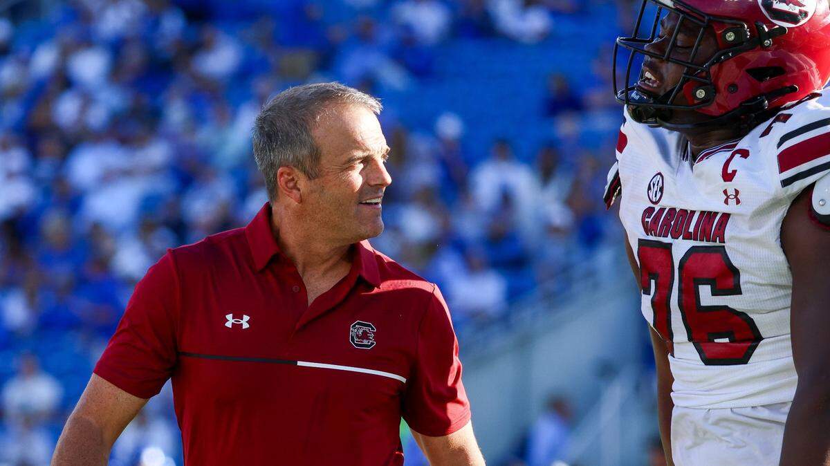 South Carolina Gamecocks head coach Shane Beamer celebrated a late third-quarter touchdown with South Carolina Gamecocks offensive lineman Torricelli Simpkins III (76) during a football game against Kentucky Saturday, Sept. 7, 2024 at Kroger Field in Lexington, Ky.