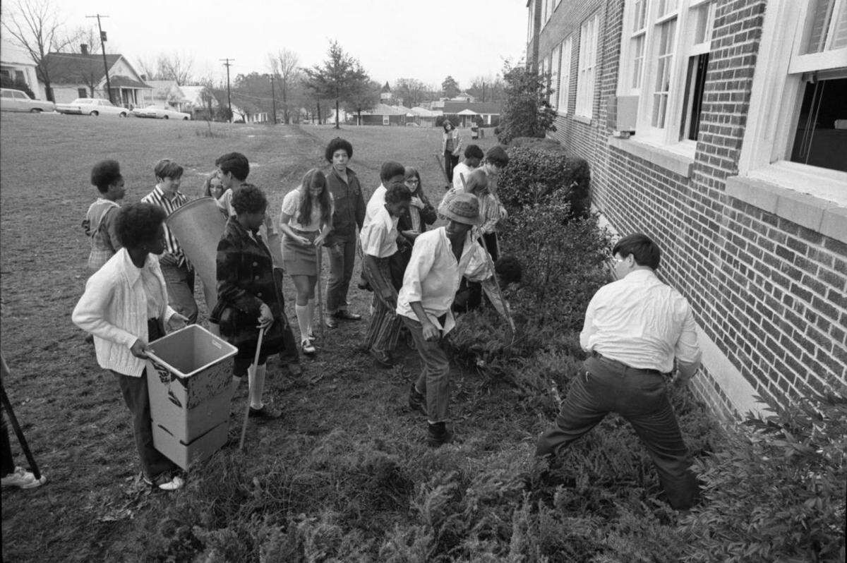 C.A. Johnson High School students clean the campus in January 1972.