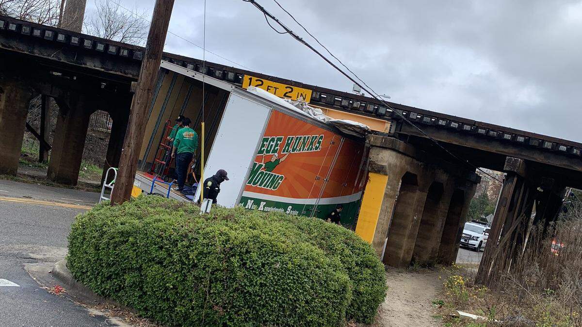 A moving van collided with a train trestle on Whaley Street near Assembly on Saturday and became stuck. Columbia police had to reroute traffic.