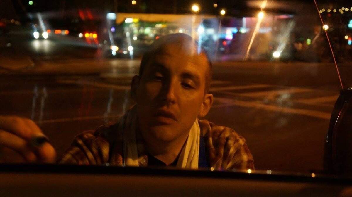 Michael David Anastasion draws messages on his car in Five Points in January before he was arrested by a Columbia police officer.
