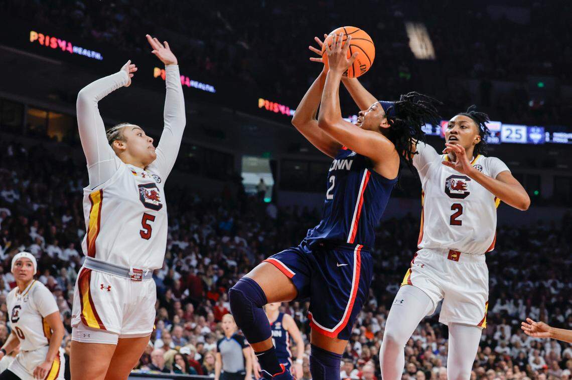South Carolina’s Ashlyn Watkins (2) and South Carolina’s Tessa Johnson (5) pressure University of Connecticut’s KK Arnold (2) during the first half of action in the Colonial Life Arena on Sunday, Feb. 11, 2024