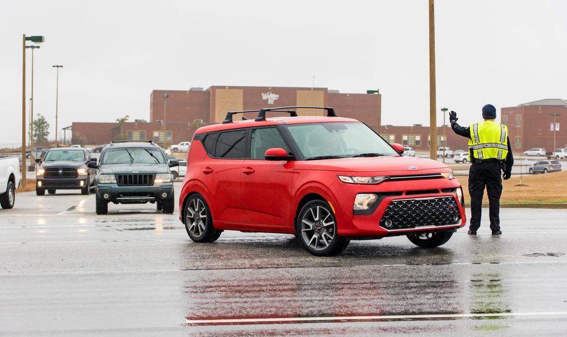 A Lexington County Sheriff’s deputy directs traffic outside White Knoll High School as parents and guardians pick up students Thursday morning after students were sent home due to a threat to the school and several others in the area Feb. 2, 2023.