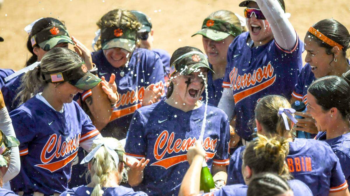 Clemson douse each other with water and sparking juice after winning the NCAA Softball Clemson Regional, a 5-1 win against Kentucky at McWhorter Stadium in Clemson Sunday, May 18, 2025.
