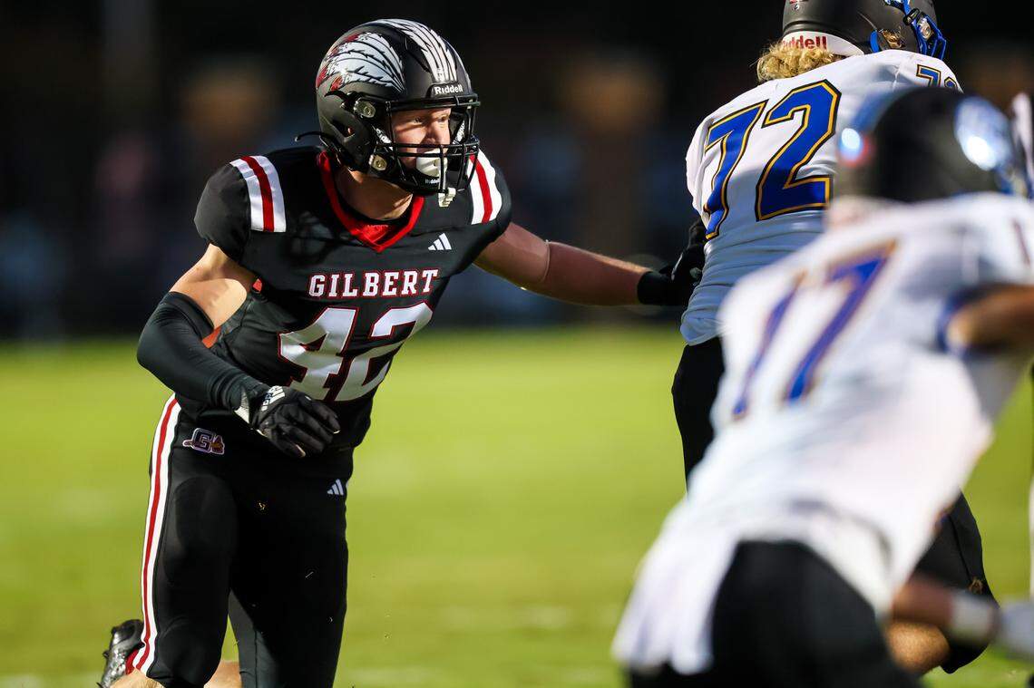 Gilbert Indians defensive lineman Caleb Strese (42) rushes against the Lexington Wildcats during their game at Gilbert High School Friday, Sept. 15, 2023.