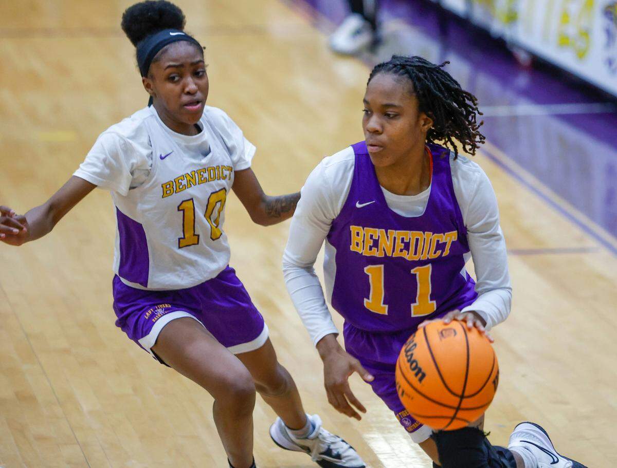 Benedict College’s Wykira Johnson-Kelly drives around Sincere Hicks during practice.