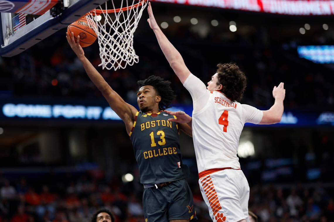 Mar 13, 2024; Washington, D.C., USA;Boston College Eagles guard Donald Hand Jr. (13) shoots the ball as Clemson Tigers forward Ian Schieffelin (4) defends in the first half at Capital One Arena.