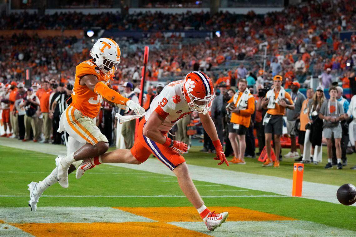 Clemson tight end Jake Briningstool (9) misses a pass in the end zone, as Tennessee linebacker Solon Page III (38) defends during the first half of the Orange Bowl NCAA college football game Friday, Dec. 30, 2022, in Miami Gardens, Fla. (AP Photo/Rebecca Blackwell)