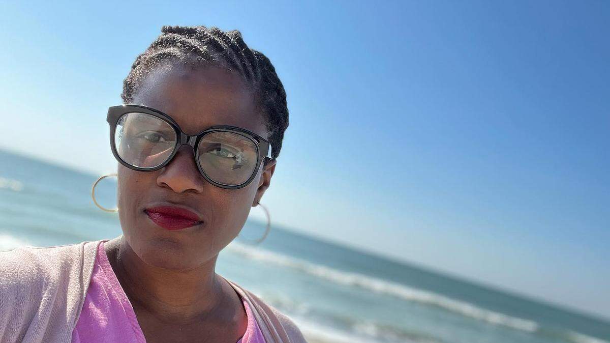 Latrese Bush on the beach near her Lowcountry Gullah-Geechie upbringing.
