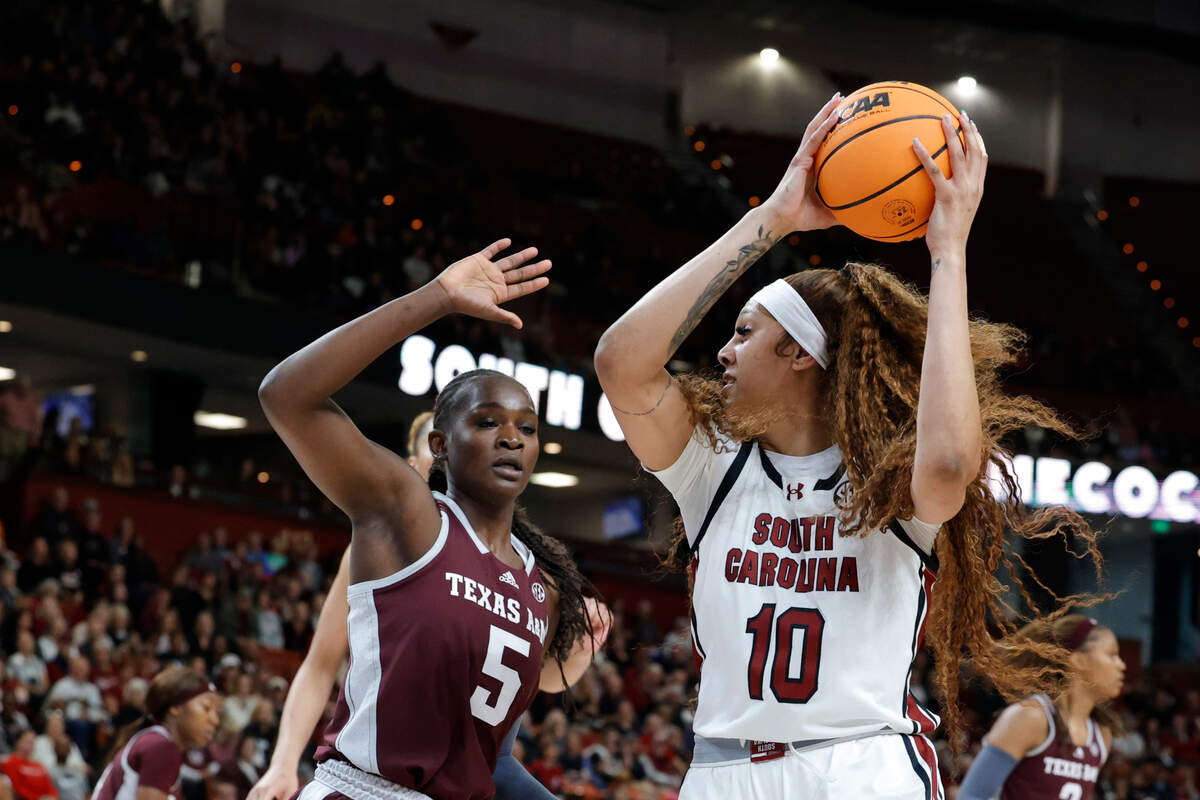 South Carolina’s Kamilla Cardoso (10) shoots as Texas A&M’s Aicha Coulibaly (5) defends during the first half of action in the Bon Secours Wellness Arena in Greenville on Friday, Mar. 8, 2024