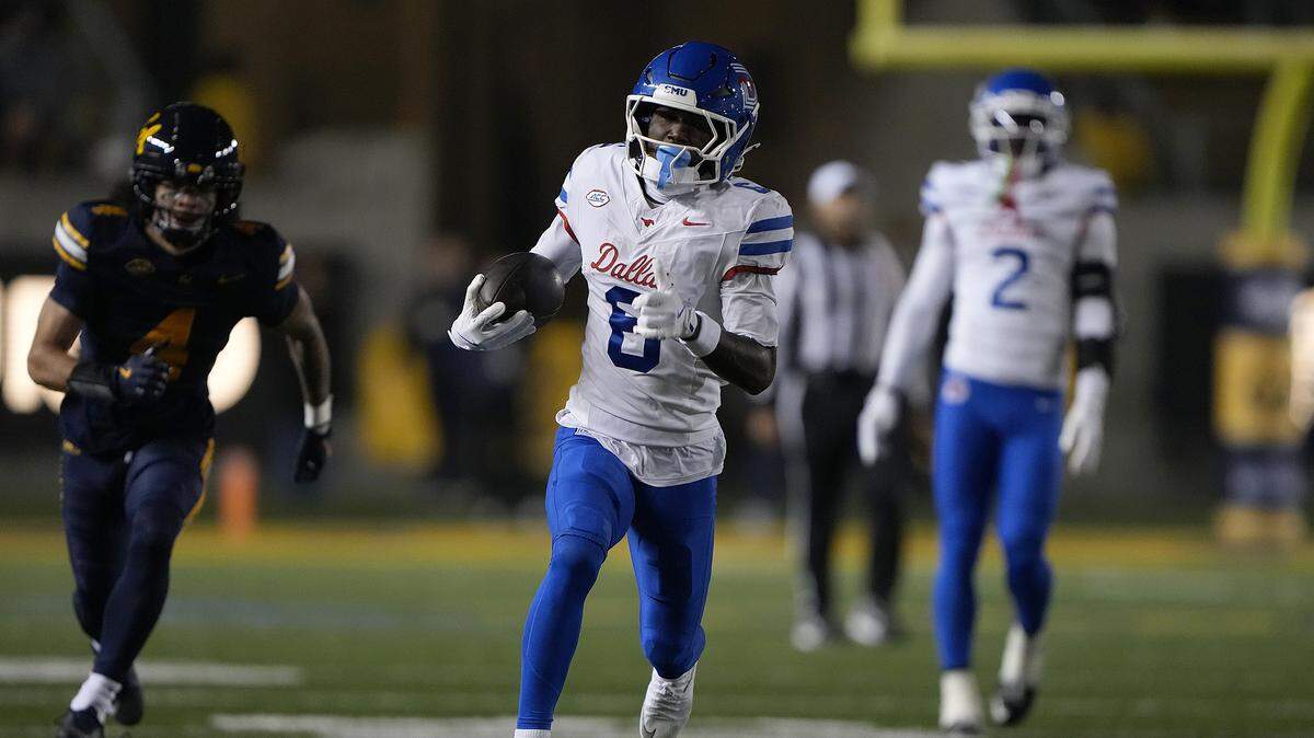Chris Johnson Jr. #6 of the Southern Methodist University Mustangs scores a touchdown on a 54 yard run against the California Golden Bears in the first half at California Memorial Stadium on November 29, 2025 in Berkeley, California.