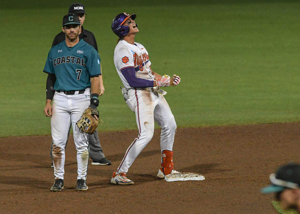 Jun 2, 2024; Clemson, South Carolina, USA; Clemson senior Jacob Hinderleider (6) reacts near Coastal Carolina sophomore Blake Barthol (7) after hitting a two-run double against Coastal Carolina University during the bottom of the eighth inning of the Clemson Regional at Doug Kingsmore Stadium.