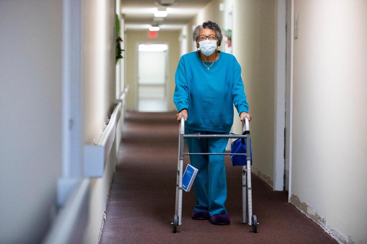 Louise Mayes at her apartment at AHEPA Senior Apartments on Wednesday, February 10, 2021. Now that Mayes is vaccinated against the coronavirus, she feels comfortable receiving physical therapy at her apartment, which includes walking down the hallway.