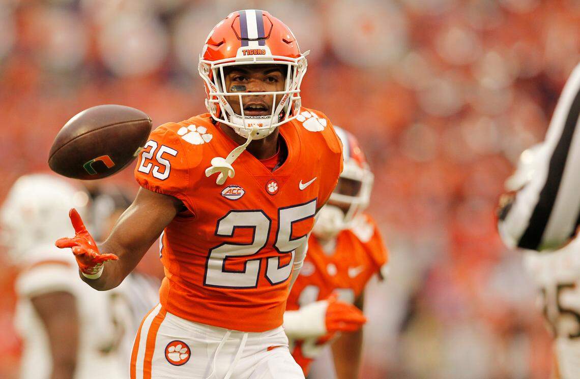 Clemson safety Jalyn Phillips (25) tosses the ball to the referee after intercepting a Miami pass during second-quarter action in Clemson, S.C. on Saturday, Nov. 19, 2022.