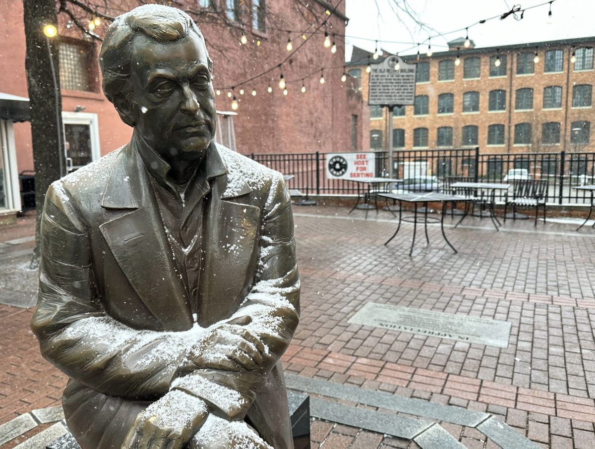 Snow falls on a statue of Vardry McBee, considered the father on Greenville, Jan. 10. 2025.