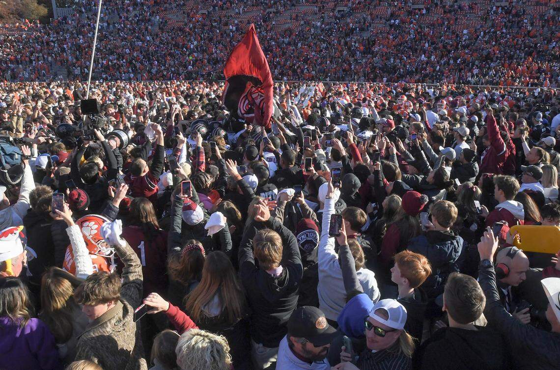 Nov 30, 2024; Clemson, South Carolina, USA; South Carolina fans celebrate on the field after the game with Clemson at Memorial Stadium.