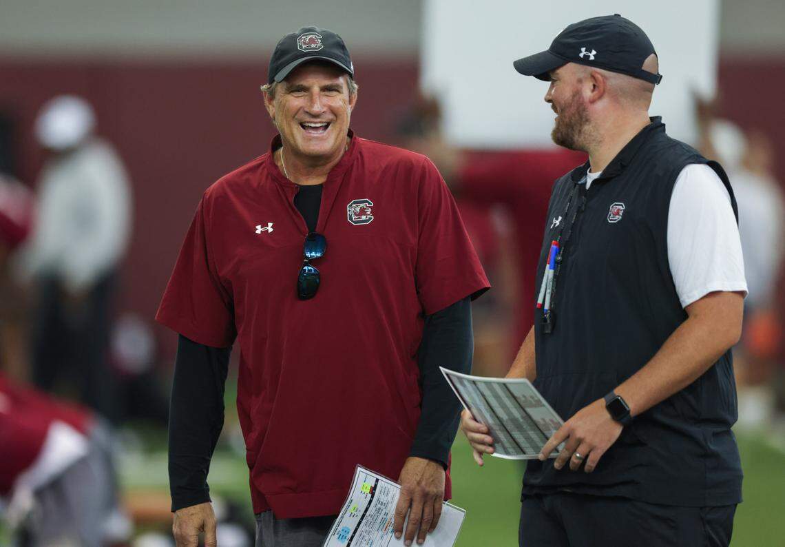 South Carolina senior offensive assistant coach Mike Shula laughs during practice in Columbia on Friday, August 9, 2024.