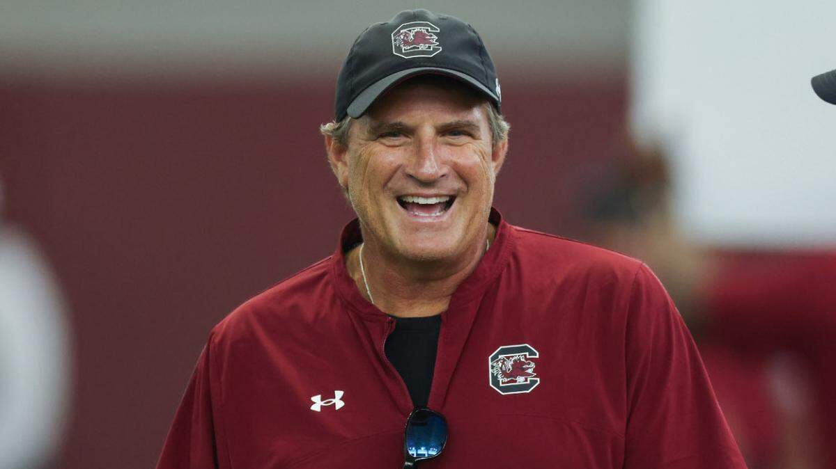 South Carolina senior offensive assistant coach Mike Shula laughs during practice in Columbia on Friday, August 9, 2024.