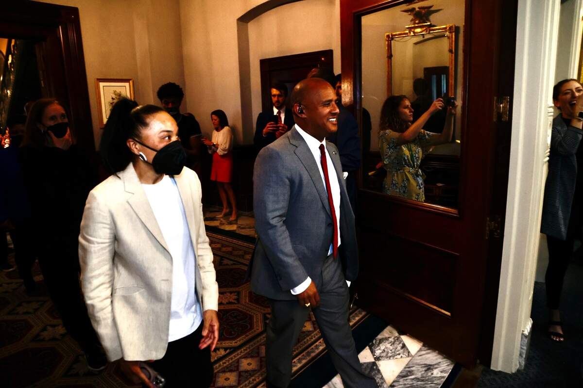 University of South Carolina women’s basketball team head coach Dawn Staley walks with House Minority Leader Todd Rutherford, D-Richland, through the State House in Columbia, S.C., on Wednesday, April 6, 2022.