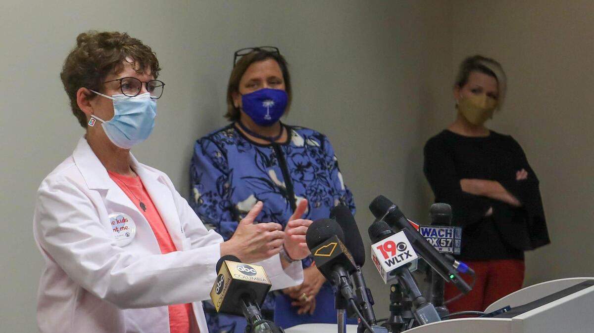 Dr. Deborah Greenhouse, with the South Carolina chapter of the American Academy of Pediatrics, joins other pediatricians and educators at a press conference in 2021.