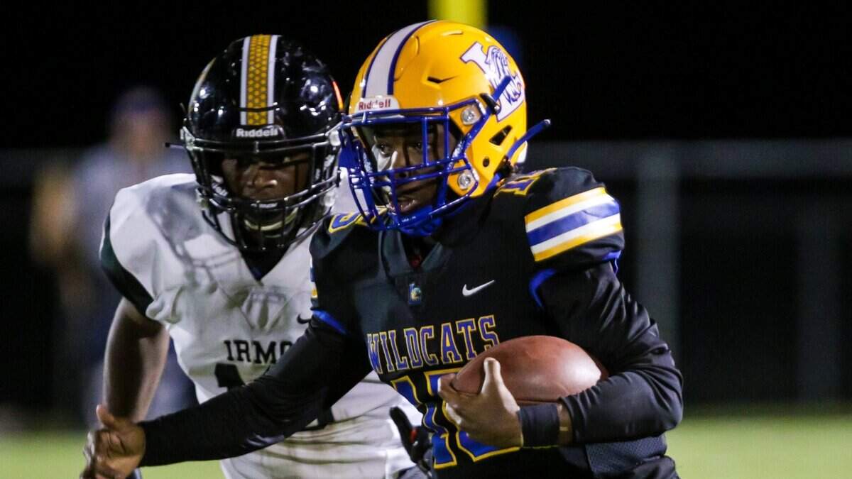 Lexington Wildcats quarterback Taiden Mines (15) passes against the Irmo Yellow Jackets.