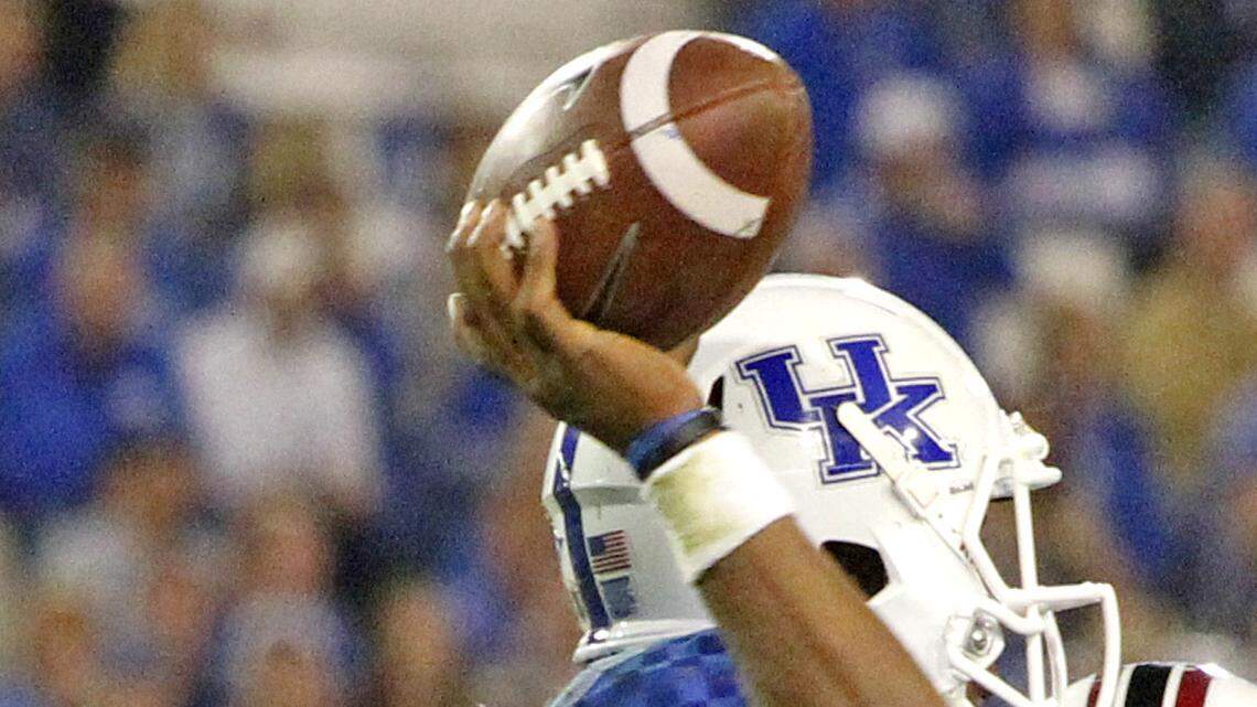 South Carolina defensive end Jadeveon Clowney (7) pressures Kentucky quarterback Jalen Whitlow (13) into an interception in the fourth quarter of the Gamecocks game against the Wildcats at Commonwealth Stadium.