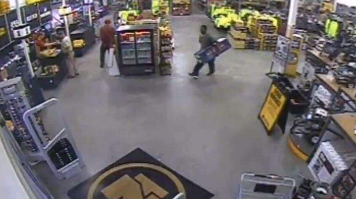 Surveillance footage shared by the Lexington County Sheriff’s Department shows a man wearing a green shirt walking out of a hardware store without paying for a chainsaw.