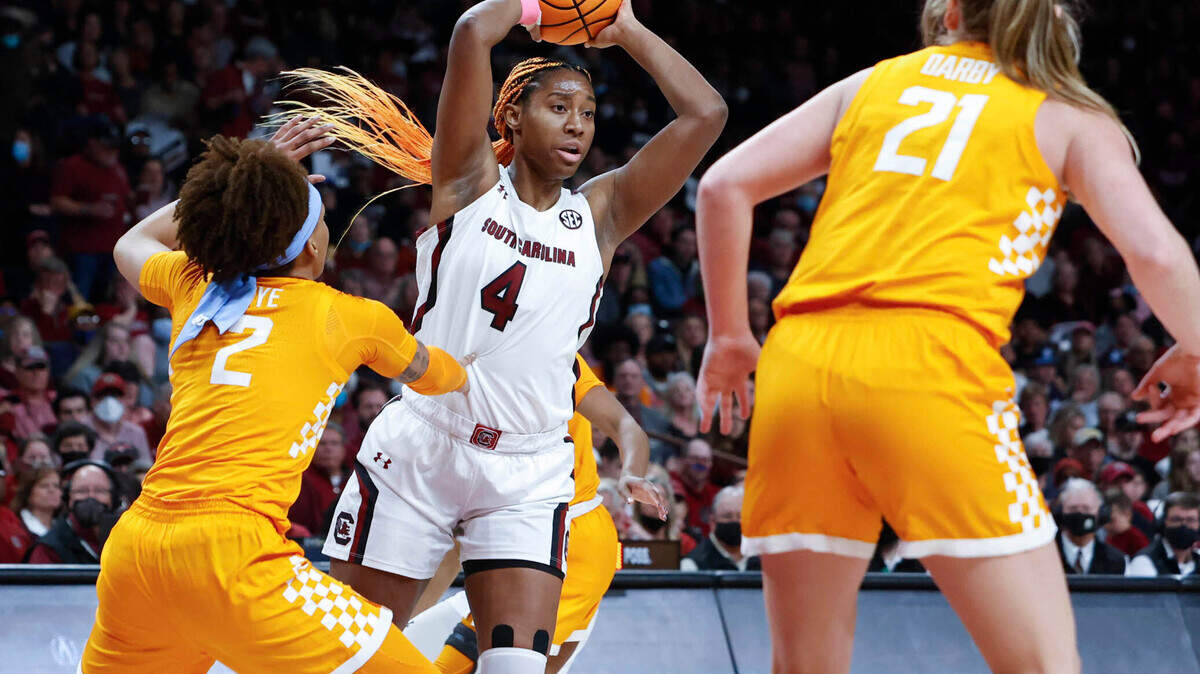 South Carolina’s Aliyah Boston (4) passes the ball as Tennessee’s Alexus Dye (2) and Tess Darby (21) pressure during the second half of action on Sunday Feb, 20, 2022 in the Colonial Life Arena.