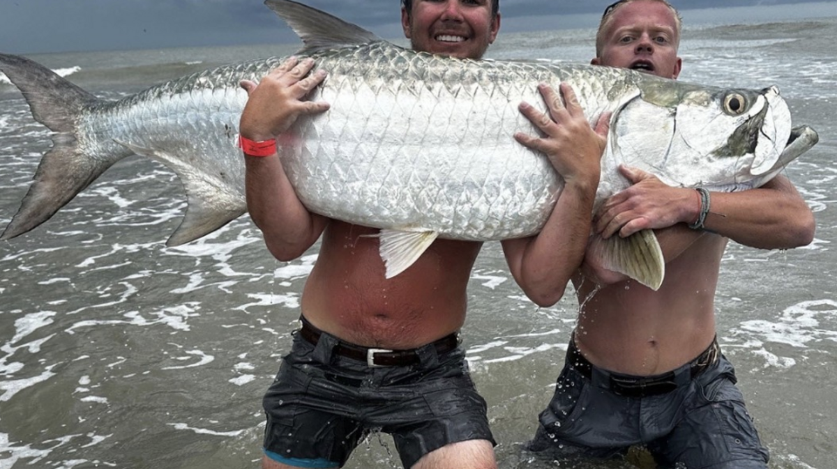 Phillip Sullivan, left, and James Strange reeled in a tarpon estimated at 150 pounds at Folly Beach.
