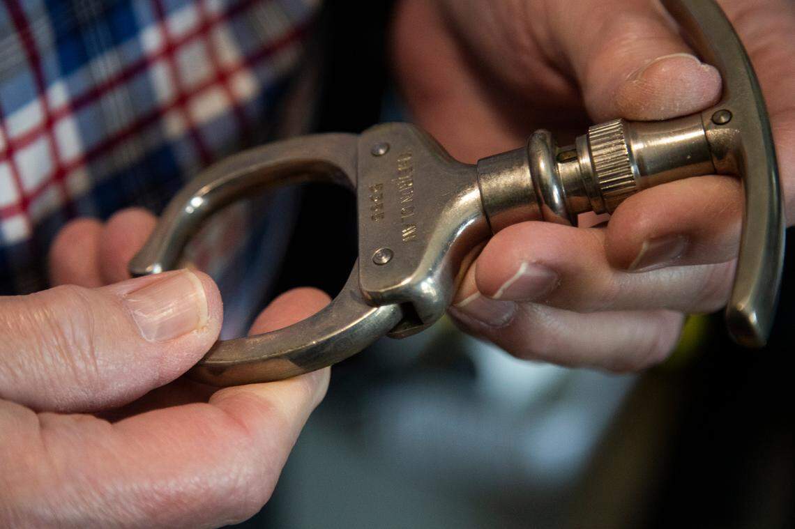 At his home in Lexington on July 3, 2021, Jim Harvey shows a device called the “iron claw” that was used to grasp the hands of people brought to the S.C. death house in the new era of executions.