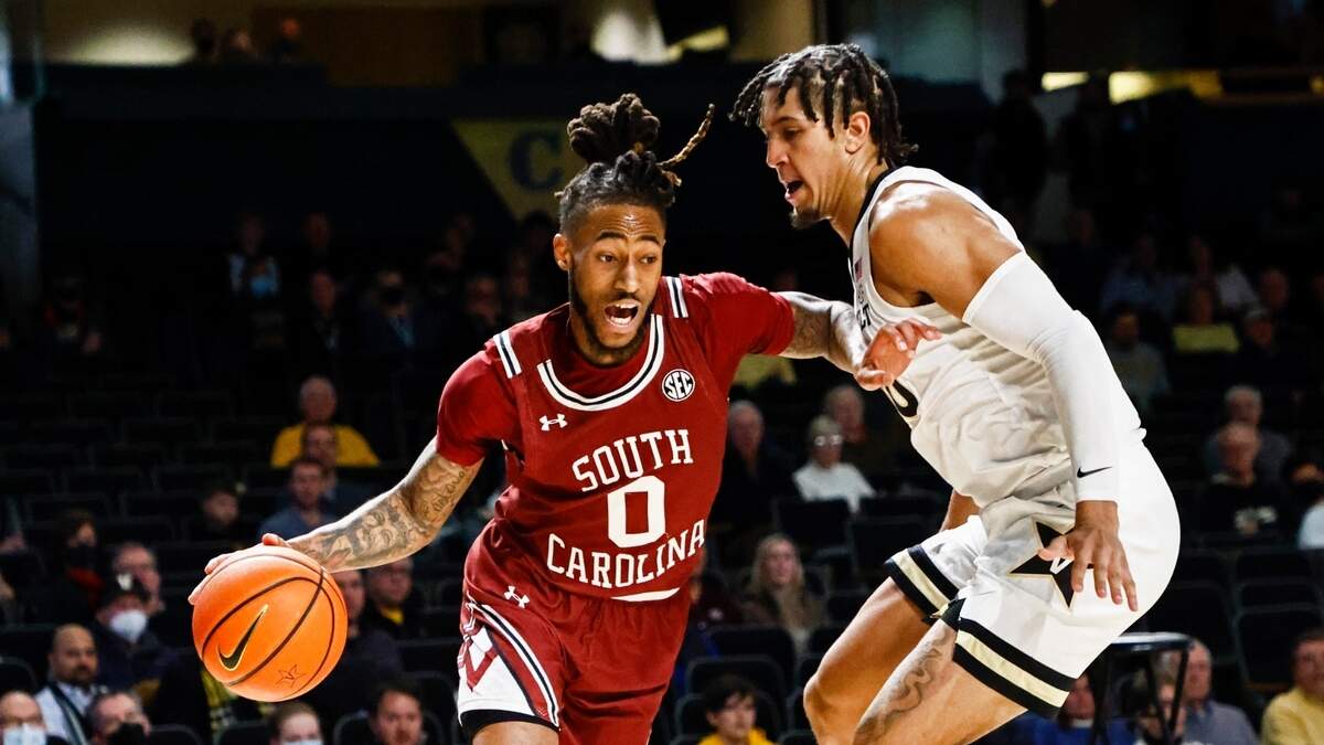 South Carolina guard James Reese V (0) drives against Vanderbilt forward Myles Stute (10) during an NCAA college basketball game Saturday, Jan. 8, 2022, in Nashville, Tenn. (AP Photo/Wade Payne)
