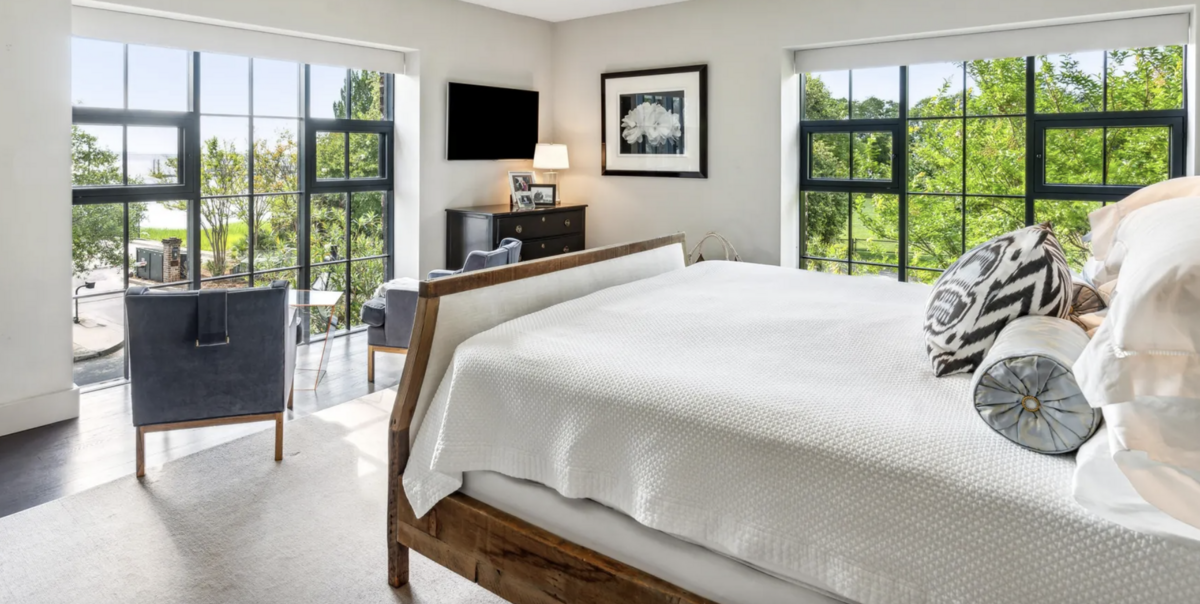 The primary suite overlooks the Cooper River.