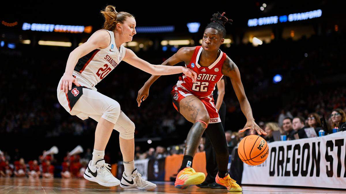 Mar 29, 2024; Portland, OR, USA; NC State Wolfpack guard Saniya Rivers (22) drives to the basket during the first half against Stanford Cardinal guard Elena Bosgana (20) in the semifinals of the Portland Regional of the 2024 NCAA Tournament at the Moda Center at the Moda Center.