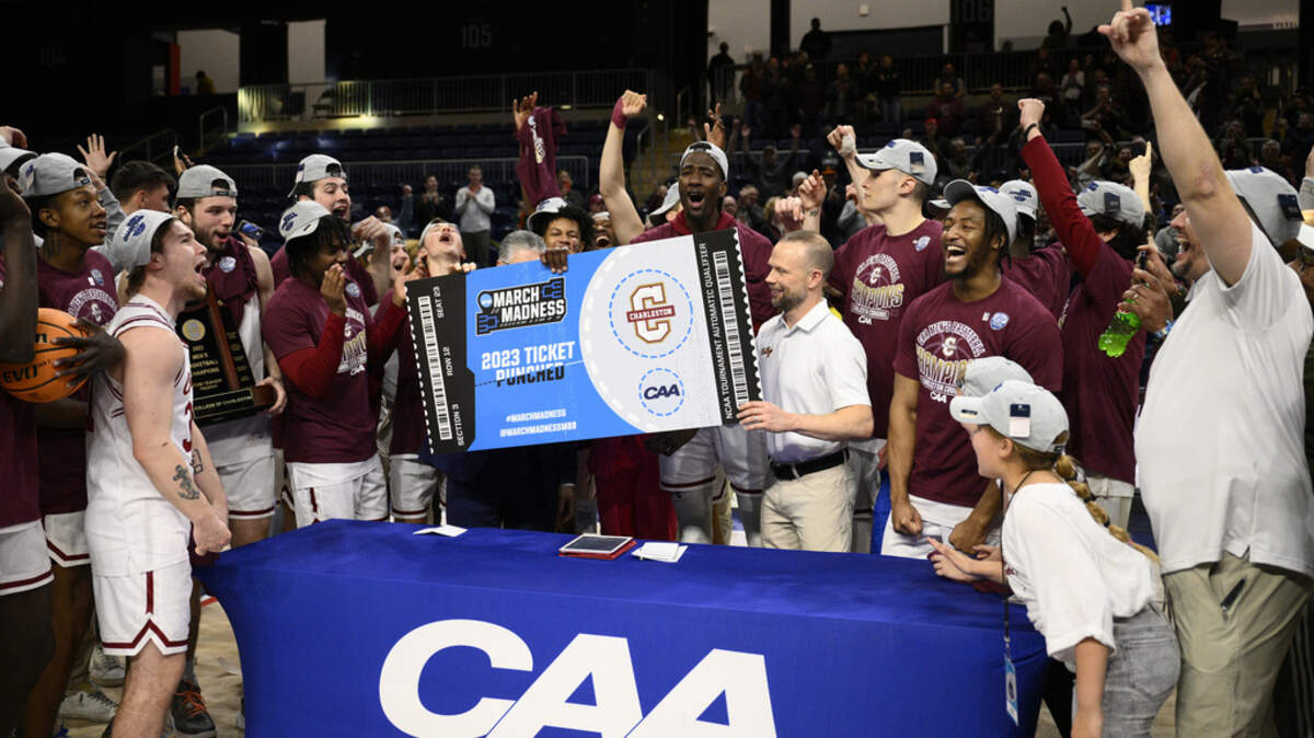 Charleston celebrates after they won the championship game of the Colonial Athletic Association conference NCAA college basketball tournament against UNC Wilmington, Tuesday, March 7, 2023, in Washington. Charleston won 63-58.