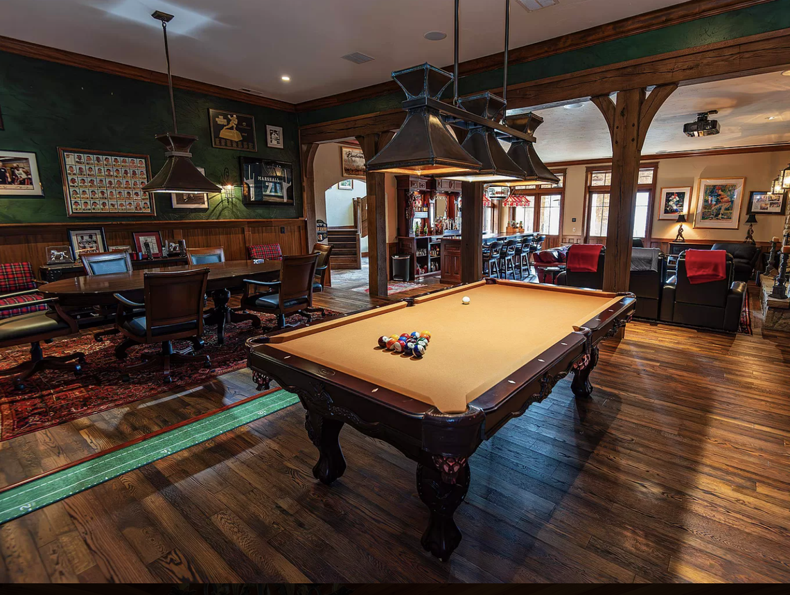 The game room and bar are two of many specialty rooms in the house.